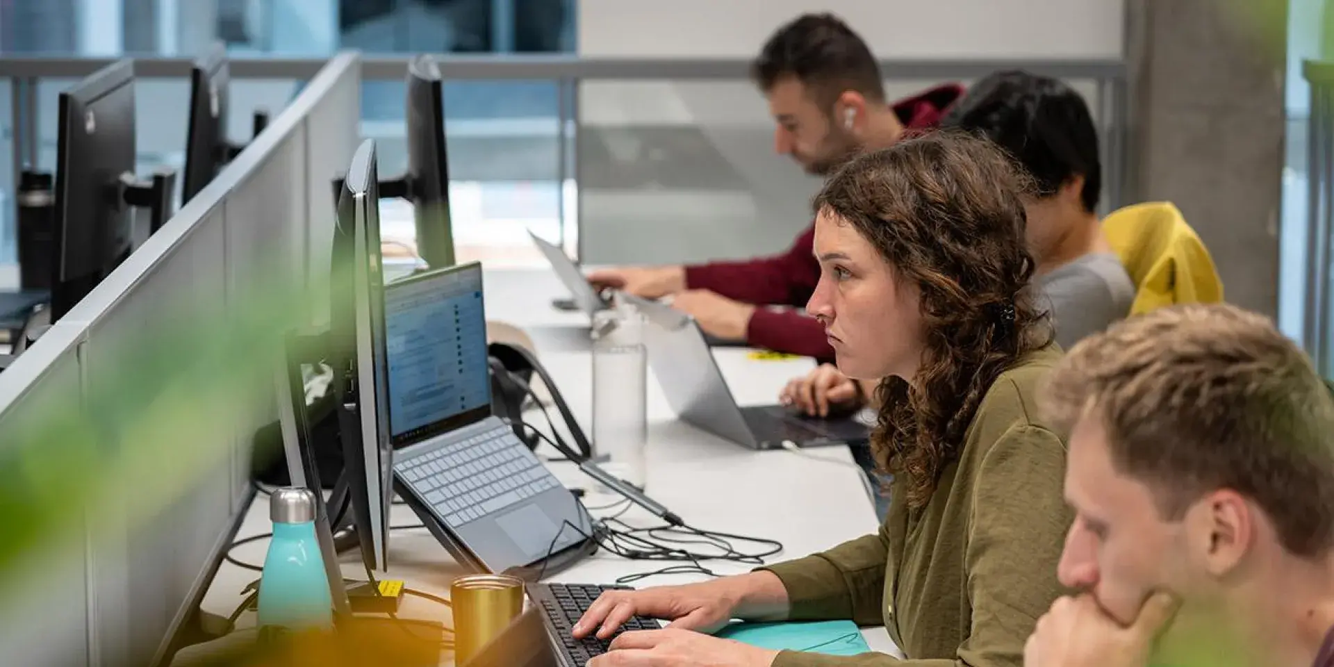 Students working on computers at a desk