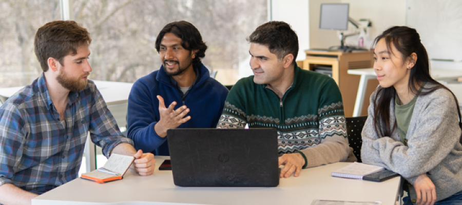 Students around a laptopp