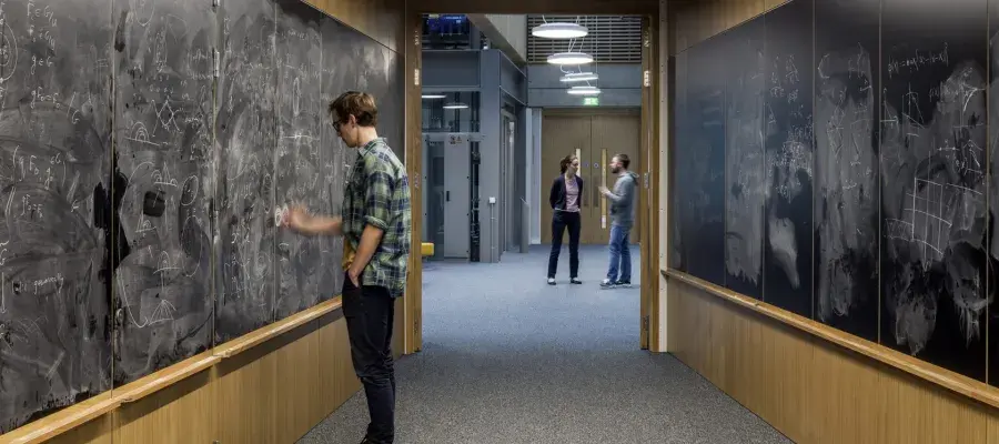 Man drawing on chalk board