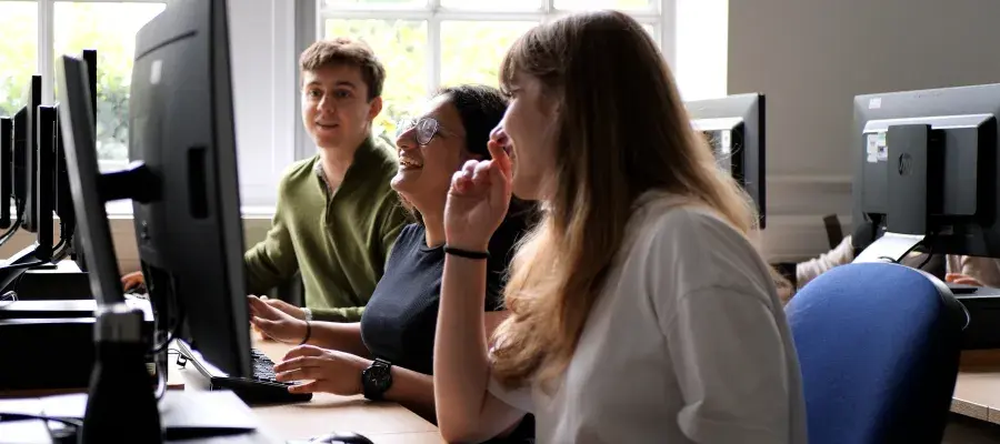 Students looking at a monitor