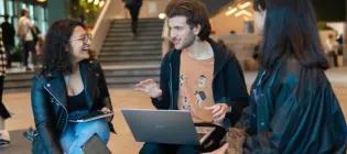 Students chatting in the Nucleus Building