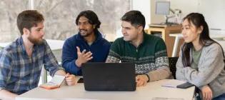 Students around a laptopp