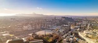 Aerial view of Edinburgh city centre with blue skies 