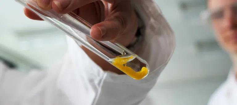 Student filling test tube