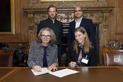 Photo of Memorandum of Understanding being signed