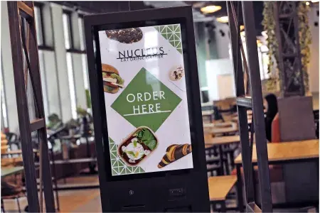 A digital screen with the text "Order here" on it 