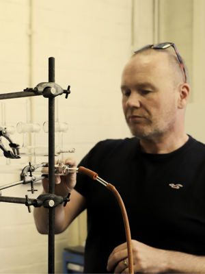 Stuart Johnstone a glassblower in his lab