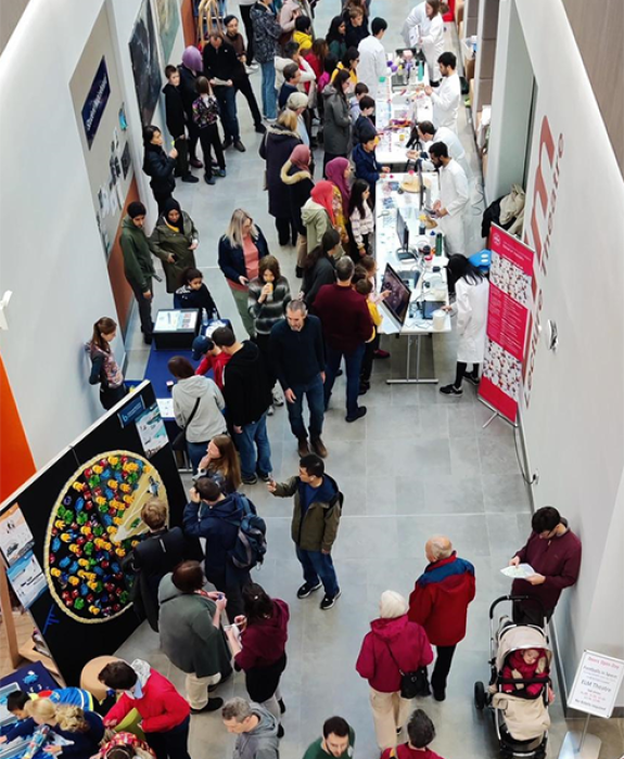 Nucleus corridor with lots of people looking at different activities for Doors Open Day